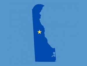 Shape of Delaware with a star representing where the State Capital is located. 
